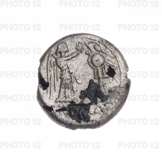 Plated coin depicting Victoria (personification) and Jupiter (mythology). Obverse: head of Jupiter right, wearing laurel wreath; beaded border. Reverse: Victoria facing right crowns a trophy; inscription 'ROMA' below a line; continuous border. After 211 BC; Roman Republic (505–27 BC). Rome. Coin. Diameter 16.9 mm; weight 2.44 g; axis 225°.