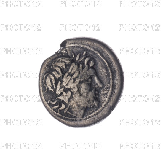 Victoria; Jupiter (mythology) — Jupiter's head; ears of grain; Wiktoria (personification); trophies; laurel wreath (attribute). Crowning Victoria. Obverse: Head of Jupiter in a laurel wreath at right. Pearl border. Reverse: Victoria facing right, crowning a trophy; between Victoria and the trophy, an ear of grain; under the line, the inscription ROMA. Continuous border. Date: 211–210 BC; Period: Roman Republic (505–27 BC); Place: Sicily. Object: coin. Diameter: 16.0 mm; Weight: 2.78 g; Axis: 180 degrees. Maker: Sabat, Bronislaw (1871–1953) (publisher).