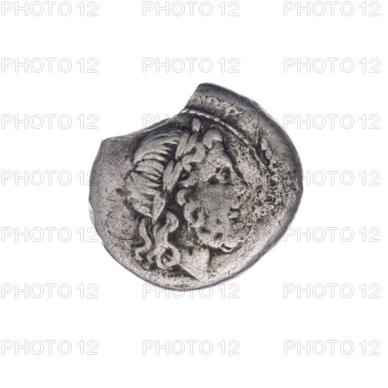 Jupiter (mythology), Victoria (personification), head of Jupiter; Bronislaw Sabat (1871–1953). Trophies, spearheads, crowning Victoria, laurel wreath (attribute). Obverse: Head of Jupiter in a laurel wreath at right. Beaded border. Reverse: Victoria facing right, crowning a trophy; between Victoria and the trophy, a spearhead; under the line, the inscription OMA. Continuous border. Date: 211–210 BC. Period: Roman Republic (505–27 BC). Place: Apulia. Minted coin. Diameter 17.1 mm; weight 2.24 g; axis 45 degrees.
