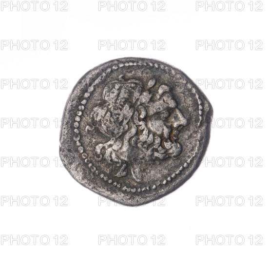 Head of Jupiter (iconographic), trophies, Victoria (personification); Sabat, Bronislaw (1871–1953). Laurel wreath (attribute), crowning Victoria (iconographic). Obverse: Head of Jupiter in a laurel wreath at right, below the letter L. Pearly border. Reverse: Victoria facing right crowns the trophy; between Victoria and the trophy the letter T; under the line the inscription ROMA. Continuous border. Date: 211–210 BC. Roman Republic (505–27 BC). Mint: Luceria. Coin; diameter 18.5 mm; weight 1.71 g; axis 270°.