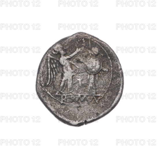 Victoria, head of Jupiter (iconographic), trophies, Victoria (personification), laurel wreath (attribute), crowning Victoria (iconographic). Obv. Head of Jupiter in a laurel wreath at right, below the letter L. Pearly border. Rev. Victoria facing right crowns the trophy; between Victoria and the trophy the letter T; under the line the inscription ROMA. Continuous border. 211–210 BC, Roman Republic (505–27 BC), Luceria; coin, diameter 18.5 mm, weight 1.71 g, axis 270°.