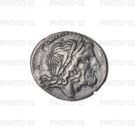 Victoria, publisher, Jupiter (mythology), head of Jupiter, Victoria (personification), trophies, Victoria crowning, laurel wreath (attribute), LT (mark of issue). Obv. Head of Jupiter in a laurel wreath at right. Pearl border. Rev. Victoria facing right, crowning a trophy; between Victoria and the trophy the letters LT (in ligature); under the line the inscription ROMA. Continuous border. 211–210 BC, Roman Republic (505–27 BC), Luceria. Coin, diameter 18.0 mm, weight 3.22 g, axis 180 degrees.