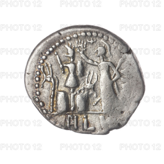 Denarius by M. Furius Philus (fl. 119 BC). Obverse: Head of Janus in a laurel wreath; inscription M.FO .LF. Beaded border. Reverse: Roma wearing a Corinthian helmet, holding a scepter in her left hand and crowning a trophy with her right; above a star; on both sides of the trophy a carnyx and a shield; below the line the inscription PHILI (PHI in ligature). Pearl border. 119 BC; Roman Republic (505–27 BC); Rome. Coin, silver; diameter 19.6 mm; weight 3.88 g; axis 225°.