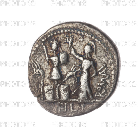 Denarius, M. Furius Philus (publisher), 119 BC. Obverse: Head of Janus in a laurel wreath; inscription M.FOVRI.LF. Beaded border. Reverse: Roma in a Corinthian helmet with a sceptre in his left hand, crowning a trophy with his right hand; above a star; on both sides of the trophy a carnyx and a shield; below the line the inscription PHILI (PHI in ligature). Pearl border. Roman Republic (505–27 BC). Roman coin; diameter 20.1 mm; weight 3.66 g; axis 270°.