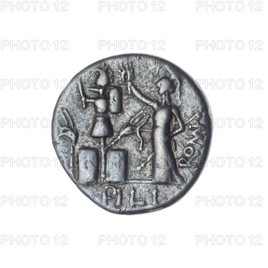 Denarius, M. Furius Philus (fl. 119 BC), obverse: head of Janus in a laurel wreath; inscription M. RI.LF.; beaded border. Reverse: Roma wearing a Corinthian helmet, holding a sceptre in her left hand and crowning a trophy with her right; above a star; behind the trophy the inscription ROMA; on both sides of the trophy a carnyx and a shield; under the line the inscription PHILI (PHI in ligature); pearl border. 119 BC; Roman Republic (505–27 BC); Rome; silver coin; diameter 17.8 mm; weight 3.23 g; axis 135°.