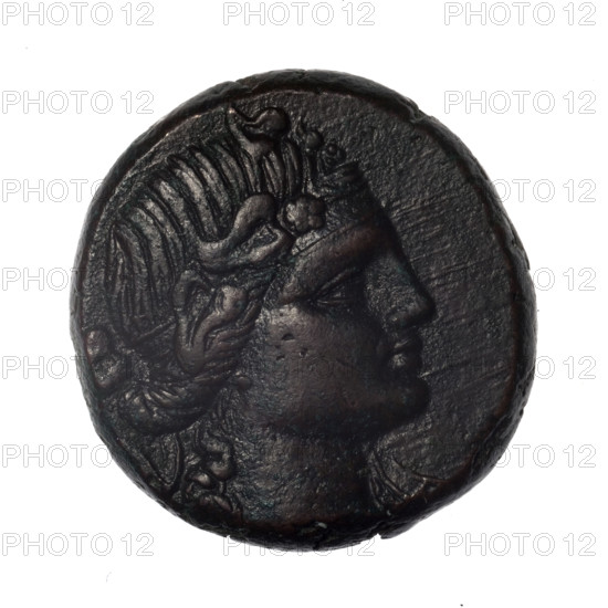 Bronze coin, Pantikapaion; obverse: head of young Dionysus in an ivy wreath facing right; reverse: bow and arrows in a gorytos with straps, monogram on the left. Iconography: bow in a quiver, head of Dionysus, gorytos, quivers, weapons, armament. Dionysus (mythology). Monograms. Black Sea. End of 2nd–ca. mid. 1st century BC (time of Mithridates VI Eupator, 120–63 BC), Cimmerian Bosporus, Pantikapaion. Coin: diameter 25.9 mm / 25.0 mm, weight 17.99 g, axis 30°. Maker: Terlecki, Ignacy (1860–1916).