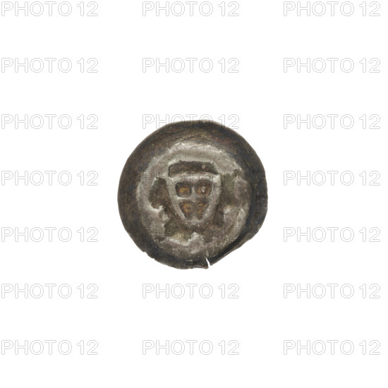 Denarius (bracteate). One-sided coin depicting a triangular shield with a cross whose arms reach the shield's edge; at the corners of the shield is one ball each. In the upper right part of the shield there is a point. On both sides of the shield are illegible markings (possibly balls). Iconography: shield with cross I; shields; triangular shield (iconographic); one-sided coins; balls; Teutonic Knights (order). Date ca. 1307/1308–ca. 1317/1318. State of the Teutonic Order (1226–1525). Diameter 15.1 mm; weight 0.21 g. WQXBCFS