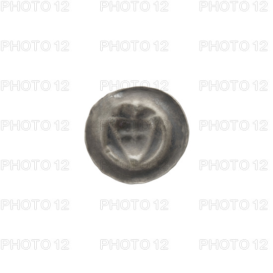 Denarius - bracteate; one-sided coin. Obverse: triangular shield with a cross whose arms reach the edge; above it a trefoil. Iconography: shield with a cross, triangular shield, trefoil. Issuer: Teutonic Knights (Order), State of the Teutonic Order (1226–1525). Date: ca. 1307/1308–ca. 1317/1318. Diameter 14.8 mm; weight 0.21 g.