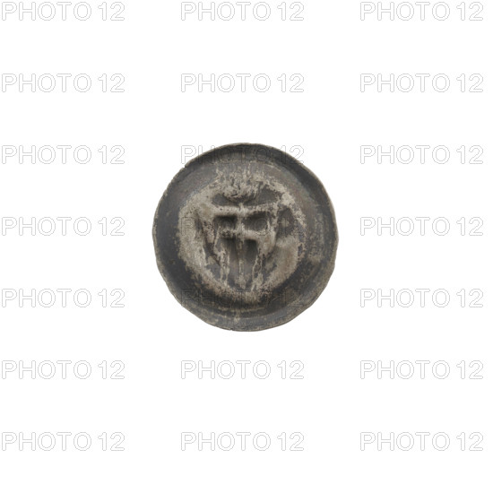 Denarius (bracteate). One-sided coin featuring a triangular shield bearing a cross with arms reaching the edge; the horizontal beam of the cross is slightly oblique. Above the shield is a cross. Iconography: shield with cross, shields, crosses. Teutonic Knights (order). Date: ca. 1307/1308–ca. 1317/1318. Medium: coin (one-sided). Diameter: 14.6–14.8 mm. Weight: 0.21 g.