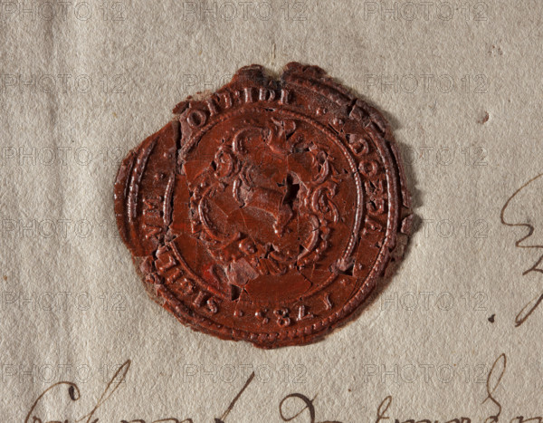 Round wax impression of the seal of Dobra. On the decorative cartouche, the end. Inscription around the rim: SIGILLUM .. OPPIDI..DOBRA..1785. 1785, Poland, seal, A close-up of a round, cracked wax seal in a deep red-brown color pressed onto a textured beige paper background, showing uneven edges and a central embossed design with curving shapes and raised borders; the paper around the seal is off-white to light tan with visible fibers and a few faint brown ink strokes at the bottom and right edges.