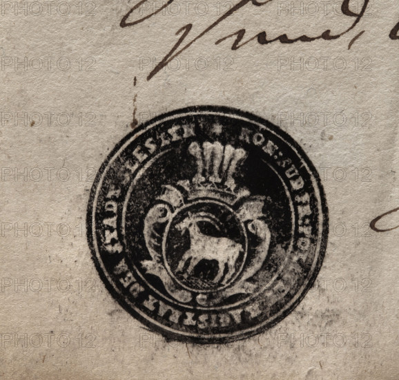 Round ink print of the seal of the town of Sleszyn. In a baroque cartouche, under an open crown with five ostrich feathers, a goat striding to the right. In the rim, the inscription: * KON(IGLICHES): SUDPR(EUSSEN) : POLIZEY MAGISTRAT DER STADT SLESZYN *, 1803, Poland.