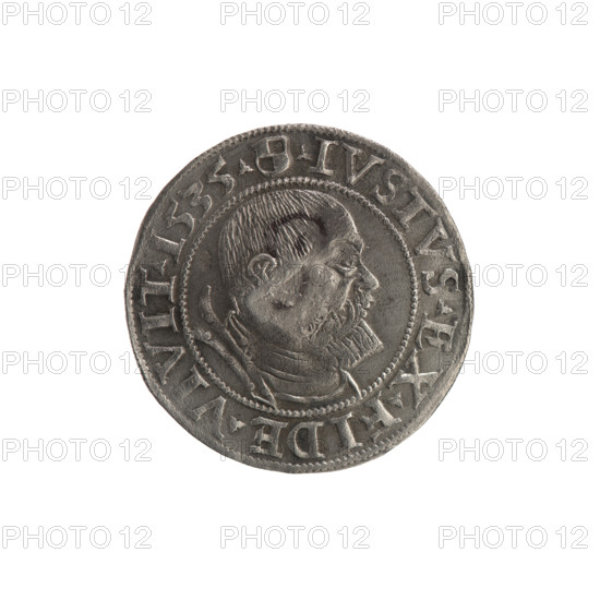 Groschen with countersignature of the City of Gdansk, 1577; publisher: Jost Ludwik Decius (fl. 1528–1535). R5 (rarity). Features: obverse—Prussian eagle with on its breast a crowned letter S; along the rim between pearly borders an inscription beginning with a rosette: 'ALBER*D*G*MAR*BRAN*DVX*PRVSS' with a countersignature stamped in place of the letter. Reverse—male bust in armor, profile right, short hair, beard with sideburns; along the rim between pearly borders an inscription beginning with the Hohenzollern coat of arms shield; trefoils between the words: 'IVSTVS EX FIDE VIVIT'. Date: 1535 (Ducal Prussia, 1525–1701), Königsberg. Coin: diameter 23.1 mm, weight 2.07 g, axis 135°. Iconography: Albrecht Hohenzollern (Prince of Prussia; 1490–1568); Hohenzollern coat of arms; rosettes; eagles; male busts in armour.