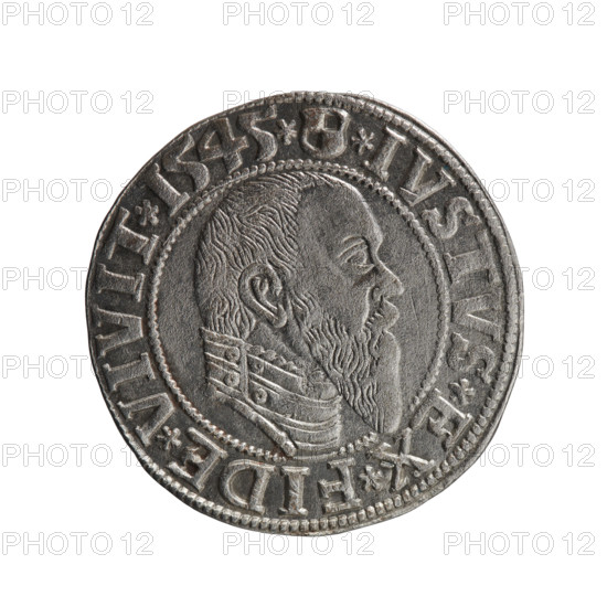 grosz; publisher: Schilling, Maciej; engraver: Decjusz, Jost Ludwik (fl. 1528–1535); R0 (rarity). Subject: Albrecht Hohenzollern (Prince of Prussia; 1490–1568). Iconography: male busts in armor, eagles, Hohenzollern coat of arms. Obverse: Prussian eagle with on its chest a crowned letter S; on the rim between pearl borders an inscription beginning with a trefoil ALBER*D*G*MAR*BRAN*DVX*PRVSS. Reverse: male bust in armor in profile turned to the right; short hair, long pointed beard with sideburns; dividing the inner rim; in the rim between the pearly borders an inscription beginning with the Hohenzollern shield *IVSTVS*EX*FIDE*VIVIT*I545*. Date: 1545, Königsberg, Ducal Prussia (1525–1701). Object: coin; diameter 23.7 mm; weight 1.96 g; axis 135°.
