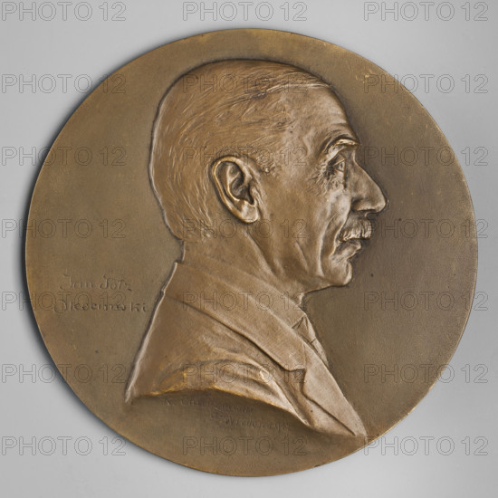 Bust of a man in right profile, hair smoothly combed back, mustache trimmed, jacket on the shoulders; on the left side an inscription in two lines: 'Jan Gotz / Okocimski, 1917.' Medallion. Artists: Jan Albin Goetz (Jan Gotz-Okocimski) and Kazimierz Mieczyslaw Chodzinski (1861–1919). Poland (Vienna).
