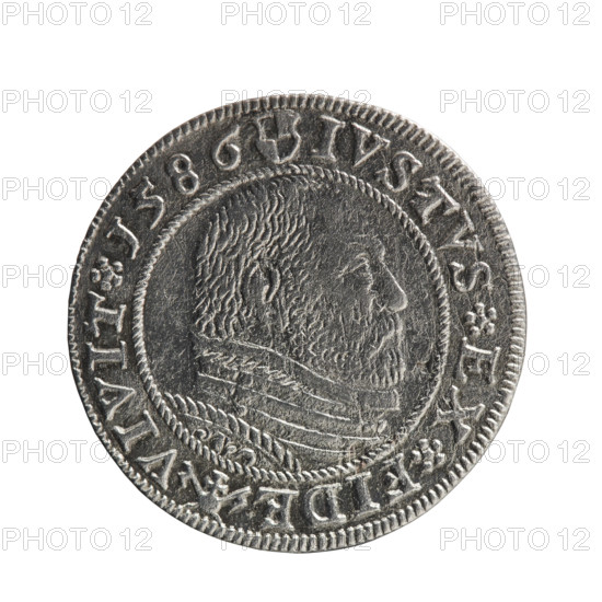 Obverse: Prussian eagle with the crowned letter S on the chest. In the rim, between the borders, an inscription beginning with a rosette GEORG.FRID:D:G:M:BR:DVX.PRVSS between the words circles. Reverse: Male bust in armour in profile turned to the right; short hair, beard with sideburns. In the rim, between the borders, an inscription beginning with the Hohenzollern coat of arms and divided by a ring topped with a cross with crossed hooks IVSTVS EX FIDE - VIVIT I 586 between the words rosettes. Maker/publisher: Pawel Gulden. Date: 1586. Place: Ducal Prussia (Königsberg). Subject and motifs: George Frederick (Duke of Karniów; 1539–1603) — iconography, Hohenzollern coat of arms, eagles, rosettes, male busts in armour. Object: coin; diameter 22.2 mm, weight 1.63 g, axis 0°.