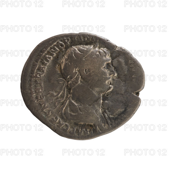 Denarius, Trajan (53–117 CE), Roman emperor (98–117). Obverse: bust of the emperor with laurel wreath and drapery, right; inscription IMP CAES NER TRAIAN OPTIM DAC PARTHICO. Reverse: naked genius stands turned left, hands holding a patera, ears of corn in left; inscription PM TR P COS VI. Date: 114–117 CE. Roman Empire. Rome. Coin. Weight 2.90 g. Axis 180°.