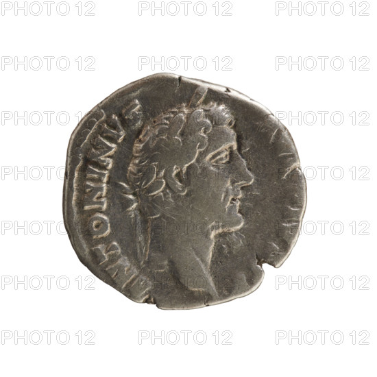 Denarius of Antoninus Pius (86–161; Roman emperor 138–161). Obverse: Emperor's head in a laurel wreath facing right with inscription 'ANTONINVS AVG PIVS PP'. Reverse: Clasped hands on a caduceus and two ears of corn with inscription 'C O S I I I I'. Iconography: hands joined on a caduceus and ears of corn; imperial bust. Hoard find (Golub). Date: 145–161. Culture: Roman Empire. Medium: silver coin. Diameter: 17.5 mm; weight: 3.20 g.