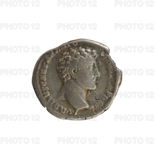Denarius, Antoninus Pius (86–161; Roman emperor 138–161). Obverse: Head of Marcus Aurelius (heir to the throne; 138–161) facing right. Inscription: AVRELIVS CAESAR ANTO NINI. Pearly border. Reverse: Clementia (personification) stands, head turned left, holding a patera in her right hand and supporting the hem of her robe with her left; inscription TR POT VI COS II and line CLEM. Pearl border. Date: 151–152. Roman Empire (27 BC–476), Rome. Coin; silver; weight 3.64 g; axis 180°.