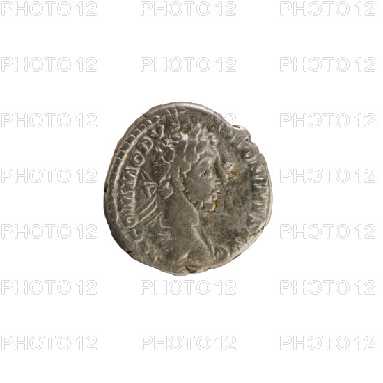 Denarius of Commodus (reigned 177–192). Obverse: bust of the emperor right, wearing a laurel wreath, armor and drapery; legend 'M COMMODV ANTONINVS AVG.' Pearl border. Reverse: Fortuna seated facing left, holding a rudder in her right hand and a cornucopia in her left, with a wheel under the seat; legend 'TR P V IMP IIII C, II PP.' Treasure from Golub (numismatic find). Cornucopia, rudder, and wheel as attributes. Roman Empire, ca. 180. Rome. Coin; weight 3.01 g; axis 180°.