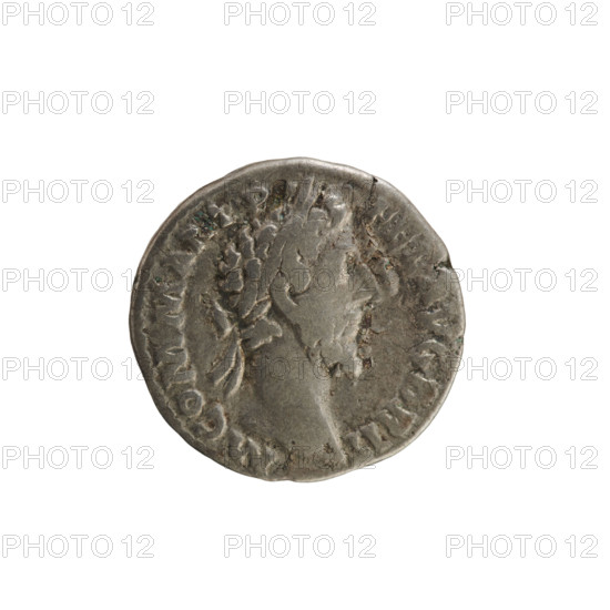 Denarius of Commodus (reigned 177–192). Obverse: Emperor's head right, wearing laurel wreath; legend 'M COMM ANT P FEL AVG BRIT' (partial). Reverse: Emperor seated on a curule chair facing left, holding a globe; legend 'PM TR P XI IM P VII COS V PP' (partial). Roman Empire, c. 185. Silver coin (denarius), weight 3.28 g, axis 180°. Iconography: imperial bust and seated emperor; numismatic treasure context.