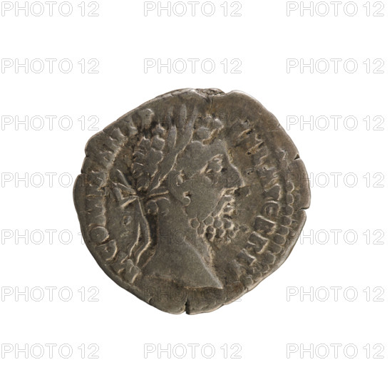 Denarius of Commodus (161–192 CE). Obverse: Emperor's head right, wearing a laurel wreath; inscription 'M COMM ANT P FEL AVG BRIT'. Reverse: Jupiter seated left, right hand raised holding a branch, left hand holding a scepter; inscription 'IOVI EXSVP PM TR P XII IMP VIII' and under the line 'COS V PP'. Roman coin, Rome, 186–187 CE; silver, weight 3.04 g, axis 180°.