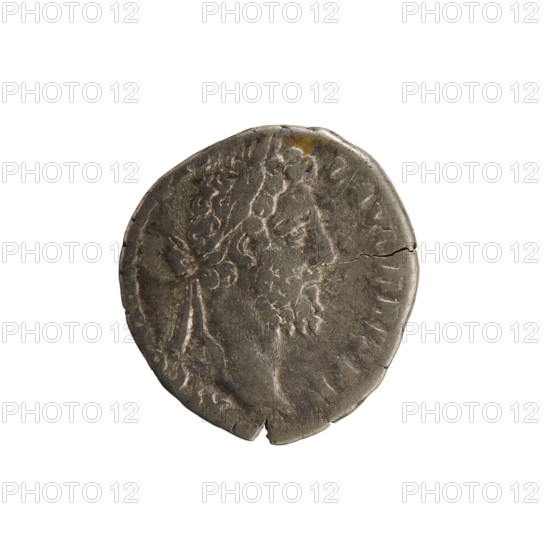 Denarius of Commodus (161–192; Roman emperor 177–192). Obverse: Emperor's bust right, wearing a laurel wreath, legend 'M CO L AVG BRIT PP'. Reverse: Apollo stands facing right, right hand raised above his head and left hand resting on a column, legend 'APOL MONET PM'. Silver coin; weight 2.85 g; axis 180°. Roman Empire, Rome, ca. 190.