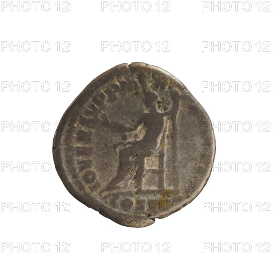 Denarius of Commodus (reign 177–192 CE). Obverse: Emperor's bust right, wearing a laurel wreath; inscription 'M COMM ANT P FEL AVG BRIT' [pearly border]. Reverse: Jupiter seated left on a throne, holding a branch in his right hand and a scepter in his left; inscription 'IOV EX SVP PM TR P' with 'COS V' in exergue [pearl border]. Date circa 186–187 CE. Roman Imperial coin (Rome). Silver, weight 2.87 g, axis 180°. Subjects: imperial bust, Jupiter, scepter; hoard find noted.