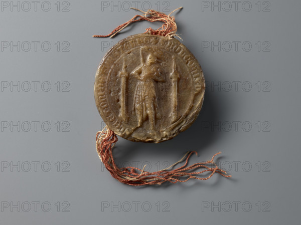 Round wax seal of Bolko II the Little (Duke of Jawor-Swidnica; 1326–1368). On-foot wax seal with countersigillum. Obverse: a knight in armor and a cloak, standing with his head turned to the right, wearing a pot helmet with a jewel in the shape of a plume of peacock feathers; in his right hand a sword held upright, in his left a shield with an eagle. Flanking the prince are two slender turrets with pointed roofs topped with balls. Around the rim the inscription: + S. BOLCONIS. D, S. SLE. ET. DNI. DE. FVRSTEBHG. Reverse (round chancellery seal / contrasigillum): in the central field a pot helmet with labras and a jewel in the shape of a peacock feather plume; rim inscription: + S. BOLCONIS. DVCIS. SLESIE. Diameter 77 mm; backing/display dimensions approx. 21.5 x 12.5 x 4.0 cm.
