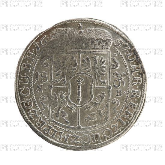 Noach Brettschneider, engraver; Jonasz Kazimierz Eulenburg, publisher. Obverse: male bust of Frederick William I Hohenzollern (Great Elector of Brandenburg; Duke of Prussia; 1620–1688) facing right in mitre and electoral mantle, holding a scepter in his right hand and resting his left on a sword hilt. Scepter and head divide the inner border and inscription; rim inscription divided by lessee's sign FRID.WILH.VGGMA - RG.ZU.BRANDE - NB: Rw. Under the ducal mitre, a five-field coat of arms with ornaments; on the left side of the shield the numerals 18. Below, on both sides of the shield, the engraver's mark N. - B. Rim inscription divided by the mitre DHRRERTZ.C.UC.ZMIPR.ZGCUBH16. - 57. Date: 1657. Place: Ducal Prussia, Königsberg. Coin: diameter 30.5 mm, weight 6.71 g, axis 0°.