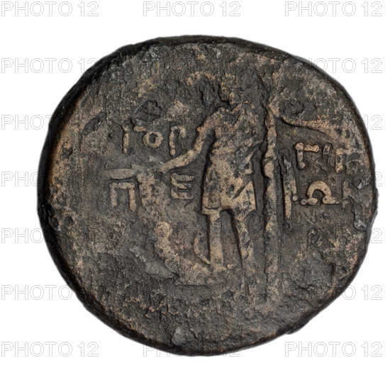 Bronze coin, Gorgippia; aw: head of Attys in a Phrygian cap decorated with stars and in a laurel wreath facing right, at the top a crescent and a star; rw: Dionysus in a short robe standing three-quarters to the left, holding a bunch of grapes in his right hand; in the left field a thyrsus with a ribbon; at the feet of Dionysus a panther sitting to the left with its head turned; in the right field a monogram; inscription in two rows on the sides. Subjects/icons: Attys (mythology), Dionysus (mythology, standing), panthers, male head, head of Men, crescent with a star, monograms. Date: 1st quarter of the 1st century BC (95–65 BC). Place: Cimmerian Bosporus, Gorgippia. Function: coin. Material: bronze. Weight: 16.90 g. Dimensions: 28.1–30 mm.