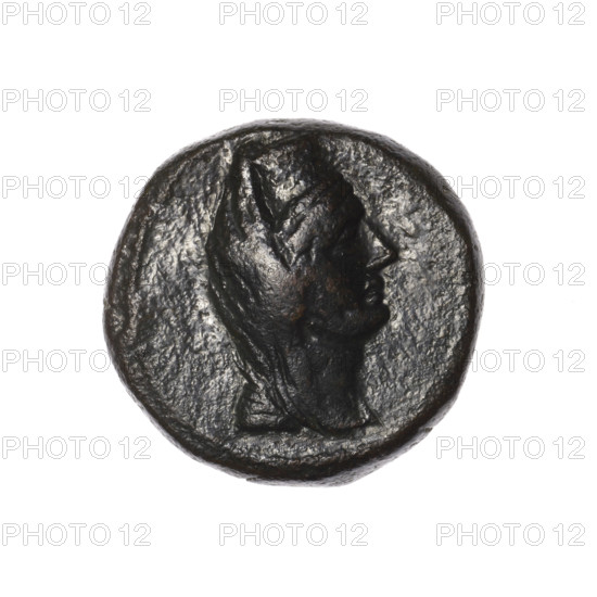 Bronze coin, Pantikapaion (as Kaisarea). Obverse: head of a woman in a kalathos and a veil (Aphrodite Urania?) facing right, pearl rim. Reverse: scepter vertically, inscription in two rows, dot below on the left, H on the right, pearl rim. Iconography: head of a woman, sceptres, Aphrodite (mythological), Aphrodite Urania (iconographic), balls, Black Sea. Aw: head of a woman in a kalathos and a veil (iconographic). Rw: scepter vertically, inscription in two rows on both sides. Date: end of the 1st century BC. Place of creation: Cimmerian Bosporus, Pantikapaion (as Kaisarea). Coin; weight 9.65 g; diameters 20.9 mm and 21.4 mm. Made by Terlecki, Ignatius (1860–1916).