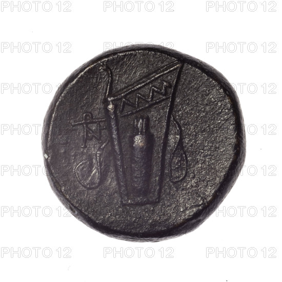 bronze coin, Pantikapaion; obverse: head of young Dionysus in an ivy wreath facing right; reverse: bow and arrows in a gorytos with straps, monogram on the left; iconography includes bow in a quiver, head of Dionysus, quivers, gorytos, bows, weapons, armament; monograms; Dionysus (mythology); Black Sea, Cimmerian Bosporus; end of 2nd–ca. mid. 1st century BC (time of Mithridates VI Eupator, 120–63 BC); coin; weight 18.90 g; dimensions 24 mm × 25.1 mm