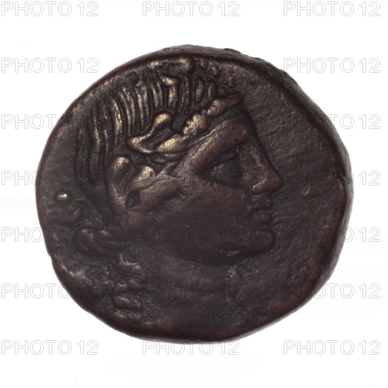 bronze coin, Pantikapaion; obverse: head of young Dionysus in an ivy wreath facing right; reverse: bow and arrows in a gorytos with straps, monogram on the left; iconography: bow in a quiver, head of Dionysus, quivers, gorytos, bows, weapons, armament; period: end of 2nd–ca. mid. 1st century BC (time of Mithridates VI Eupator, 120–63 BC); region: Cimmerian Bosporus; material: bronze; type: coin; weight 18.72 g; axis 330°; dimensions: 25.3 mm × 26.6 mm; maker/attribution: Pantikapaion; inscription/marks: monograms.
