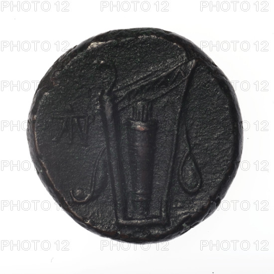 Bronze coin, Pantikapaion; obverse: head of young Dionysus in an ivy wreath facing right; reverse: bow and arrows in a gorytos with straps, monogram on the left. Iconography: bow in a quiver, head of Dionysus, gorytos, quivers, monograms, bows, weapons, armament. Date: end of 2nd — ca. mid. 1st century BC (time of Mithridates VI Eupator, 120–63 BC). Cultural/Geographic: Cimmerian Bosporus, Black Sea, Pantikapaion. Weight: 18.01 g. Diameter: 25.5 mm.