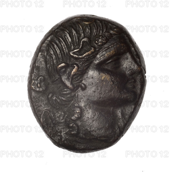 Bronze coin, Pantikapaion; obverse: head of young Dionysus in an ivy wreath facing right; reverse: bow and arrows in a gorytos with straps, monogram on the left. Iconography: bow in a quiver, head of Dionysus, gorytos, quivers, bows, weapons, armament. Monograms present. Date: end of 2nd – ca. mid. 1st century BC (time of Mithridates VI Eupator, 120–63 BC). Region: Cimmerian Bosporus, Pantikapaion. Weight: 16.90 g. Dimensions: 27.5 mm × 23.3 mm.