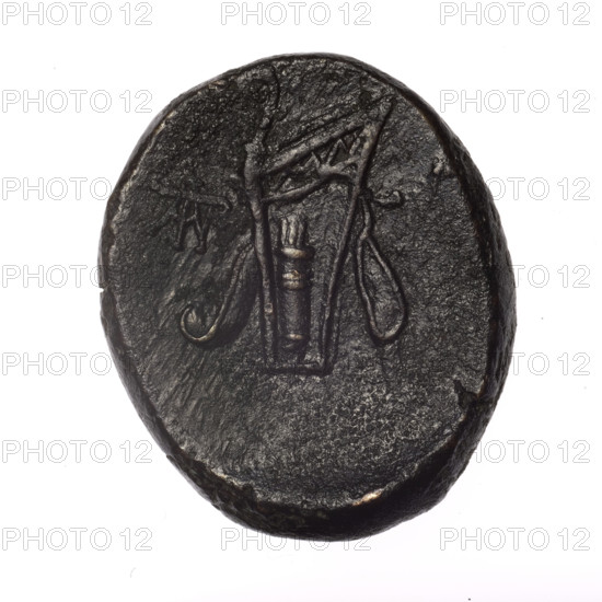 bronze coin, Pantikapaion; obverse: head of young Dionysus in an ivy wreath facing right; reverse: bow and arrows in a gorytos with straps, monogram on the left; iconography: bow in a quiver, head of Dionysus, gorytos, quivers, bows, weapons, armament; monograms; Dionysus (mythology); Black Sea region; end of 2nd–ca. mid 1st century BC (time of Mithridates VI Eupator, 120–63 BC), Cimmerian Bosporus; coin; weight 16.90 g; dimensions: 27.5 mm × 23.3 mm; maker: Pantikapaion
