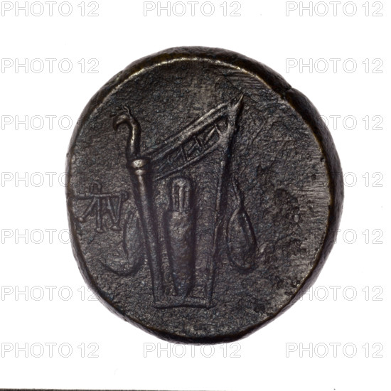 bronze coin, Pantikapaion; obverse: head of young Dionysus in an ivy wreath facing right; reverse: bow and arrows in a gorytos with straps, monogram on the left; iconography: bow in a quiver, gorytos, quivers, weapons, armament, Dionysus; monograms; Black Sea, Cimmerian Bosporus, Pantikapaion; end of 2nd–ca. mid. 1st century BC (time of Mithridates VI Eupator (120–63 BC)); coin; weight 15.79 g; diameters 25.8 mm and 24.4 mm.