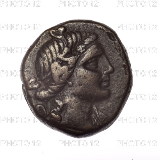 bronze coin, Pantikapaion; obverse: head of young Dionysus in ivy wreath facing right; reverse: bow and arrows in gorytos with straps, monogram on the left; iconography: bow in quiver, head of Dionysus, gorytos, quivers, weapons; inscriptions/marks: monograms; region: Cimmerian Bosporus (Pantikapaion); date: 1st century BC (time of Mithridates VI Eupator, 120–63 BC) — end of 2nd–mid-19th c.; material: bronze; weight: 16.40 g; dimensions: 25.2 mm × 24.1 mm.