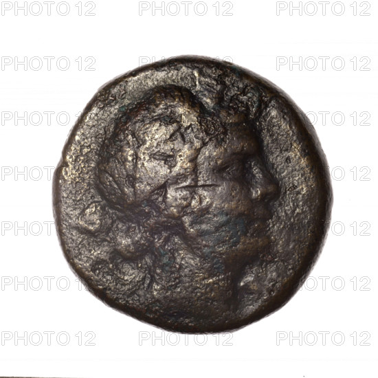 Bronze coin, Pantikapaion; obverse: head of young Dionysus in an ivy wreath facing right; reverse: bow and arrows in a gorytos with straps, monogram on the left; iconography: bow in a quiver, head of Dionysus, gorytos, quivers, bows, weapons, armament; inscriptions/marks: monograms; geography: Black Sea, Cimmerian Bosporus, Pantikapaion; date: end of 2nd–ca. mid. 1st century BC (time of Mithridates VI Eupator, 120–63 BC); material: bronze; function: coin; weight: 16.98 g; dimensions: 25.1 mm × 25.3 mm.