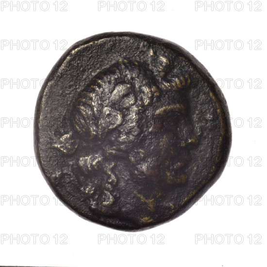 Bronze coin, Pantikapaion; obverse: head of young Dionysus in ivy wreath facing right; reverse: bow and arrows in gorytos with straps, monogram on the left. Iconography: bow in quiver, gorytos, quivers, bows, weapons, armament; mythology: Dionysus. Dated end of 2nd–ca. mid 1st century BC (time of Mithridates VI Eupator, 120–63 BC), Cimmerian Bosporus. Weight 16.20 g; diameter ~25.2–25.4 mm.