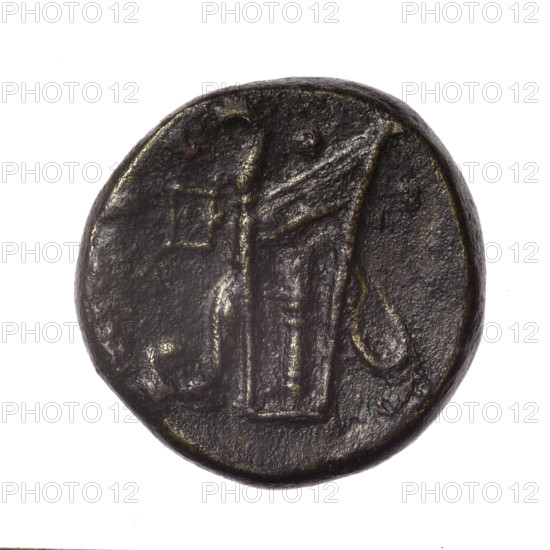 Bronze coin from Pantikapaion. Obverse: head of young Dionysus in ivy wreath facing right. Reverse: bow and arrows in a gorytos with straps; monogram at left. Iconography includes bow in quiver, gorytos, quivers, Dionysus, bows, weapons, armament. Date: end of 2nd–ca. mid 1st century BC (time of Mithridates VI Eupator, 120–63 BC). Culture/area: Cimmerian Bosporus, Pantikapaion. Weight: 16.20 g. Diameter: ~25.2–25.4 mm.