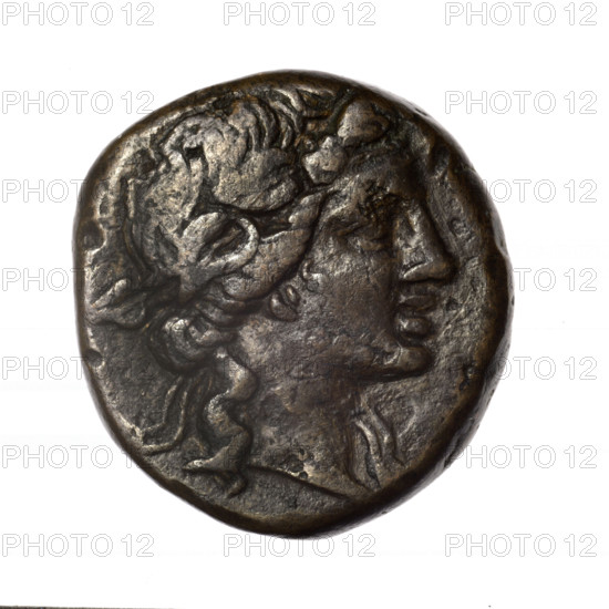 Bronze coin, Pantikapaion; obv.: head of young Dionysus in an ivy wreath facing right; rv.: bow and arrows in a gorytos with straps, monogram on the left; iconography: bow in a quiver, head of Dionysus, gorytos, quivers, bows, weapons, armament; Dionysus (mythology); end of 2nd – ca. mid. 1st century BC (time of Mithridates VI Eupator, 120–63 BC); Cimmerian Bosporus; coin; weight 18.03 g; dimensions 26.1 mm × 25.2 mm.