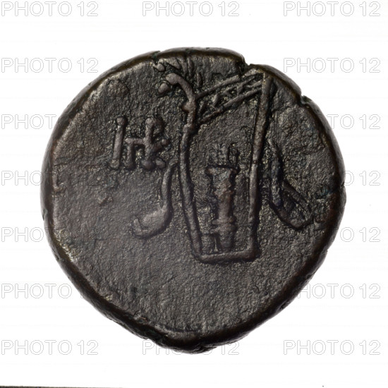 bronze coin, Pantikapaion; obverse: head of young Dionysus in an ivy wreath facing right; reverse: bow and arrows in a gorytos with straps, monogram on the left; iconography: Dionysus, bow in quiver, gorytos, quivers, bows, weapons, armament; monograms; Black Sea, Cimmerian Bosporus, Pantikapaion; dated end of 2nd–ca. mid. 1st century BC (time of Mithridates VI Eupator, 120–63 BC); coin; weight 17.56 g; dimensions 26.8–26.9 mm.