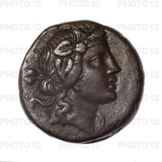 bronze coin, Pantikapaion; obverse: head of young Dionysus in an ivy wreath facing right; reverse: bow and arrows in a gorytos with straps, monogram on the left; iconography: bow in a quiver, head of Dionysus, gorytos, quivers, bows, weapons, armament; inscriptions/marks: monograms; date: end of 2nd–ca. mid. 1st century BC (time of Mithridates VI Eupator, 120–63 BC); region: Cimmerian Bosporus; weight: 17.55 g; diameter: 26.1–26.6 mm; maker: Pantikapaion.