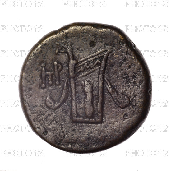 bronze coin, Pantikapaion; obverse: head of young Dionysus in an ivy wreath facing right; reverse: bow and arrows in a gorytos with straps, monogram on the left; iconography: bow in a quiver, head of Dionysus, gorytos, quivers, bows, weapons, armament; monograms; Dionysus (mythology); Black Sea region; end of 2nd – ca. mid 1st century BC (time of Mithridates VI Eupator, 120–63 BC); Cimmerian Bosporus; coin; weight 17.55 g; diameter ~26.1–26.6 mm; maker: Pantikapaion.