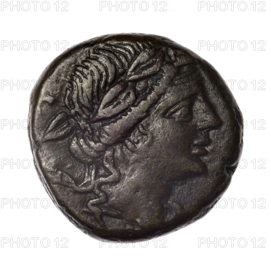 Bronze coin, Pantikapaion; obverse: head of young Dionysus in an ivy wreath facing right; reverse: bow and arrows in a gorytos with straps, monogram on the right. Iconography: bow in a quiver, head of Dionysus, gorytos, monograms, quivers, bows, weapons, armament. Date: end of 2nd — ca. half of 1st century BC (time of Mithridates VI Eupator, 120–63 BC), Cimmerian Bosporus, Pantikapaion. Coin; weight 18.76 g; diameters 25.1 mm and 25.8 mm.