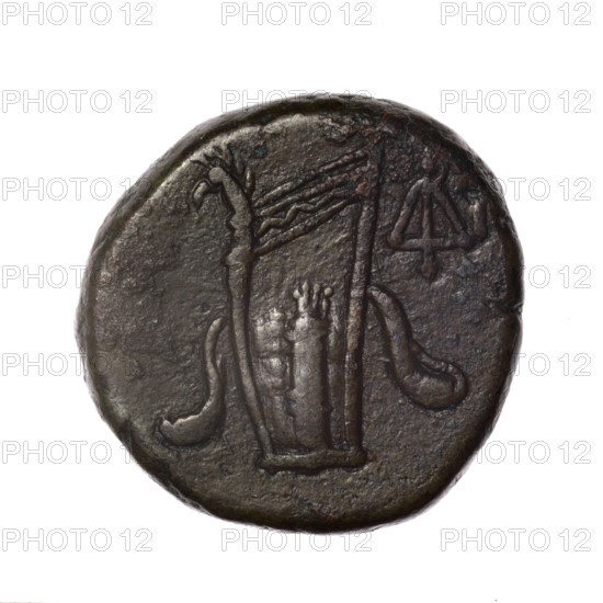 bronze coin, Pantikapaion; obverse: head of young Dionysus in an ivy wreath facing right; reverse: bow and arrows in a gorytos with straps, monogram on the right; iconography: bow in a quiver, head of Dionysus, gorytos, quivers, monograms, bows, weapons, armament; mythological subject: Dionysus; date: end of 2nd — ca. half of 1st century BC (time of Mithridates VI Eupator, 120–63 BC); cultural context: Cimmerian Bosporus, Pantikapaion; material: bronze; type: coin; weight: 18.76 g; dimensions: 25.1 mm × 25.8 mm.