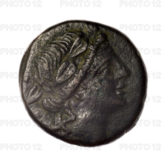 Bronze coin, Pantikapaion; obverse: head of young Dionysus in an ivy wreath facing right; reverse: bow and arrows in a gorytos with straps, monogram on the right. Iconography: Dionysus, bow in quiver, gorytos, quivers, weapons, armament. Monograms present. Date: end of 2nd–ca. mid-1st century BC (time of Mithridates VI Eupator, 120–63 BC). Region: Cimmerian Bosporus (Pantikapaion). Coin; weight 15.54 g; diameters 24.7 mm and 25.2 mm. Maker: Terlecki, Ignacy (1860–1916) mentioned.