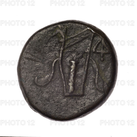 bronze coin, Pantikapaion; obverse: head of young Dionysus in an ivy wreath facing right; reverse: bow and arrows in a gorytos with straps, monogram on the right; iconography: head of Dionysus, bow in quiver, gorytos, quivers, weapons, armament; monograms; inscriptions: monogram on reverse; provenance: Cimmerian Bosporus, Pantikapaion; date: end of 2nd – ca. mid. 1st century BC (time of Mithridates VI Eupator, 120–63 BC); material: bronze; weight: 15.54 g; dimensions: 24.7–25.2 mm
