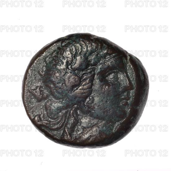 bronze coin, Pantikapaion; obverse: head of young Dionysus in an ivy wreath facing right; reverse: bow and arrows in gorytos with straps, monogram on the left; iconography: bow in quiver, head of Dionysus, quivers, gorytos, bows, weapons, armament; monograms; Dionysus (mythology); Black Sea region, Cimmerian Bosporus, Pantikapaion; end of 2nd–ca. mid. 1st century BC (time of Mithridates VI Eupator, 120–63 BC); coin; weight 15.76 g; dimensions 22.7 × 25 mm